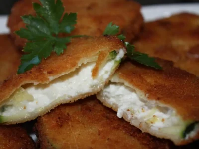 Calabacín relleno de quesos y york